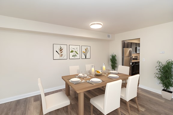 a dining room with a wooden table and chairs at Olde Towne in Kenwood, Cincinnati, 45243