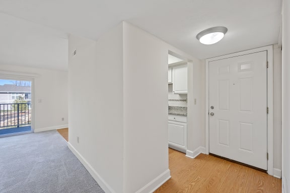 a bedroom with a closet and a door to a bathroom at Harpers Point Apartments, Cincinnati, OH