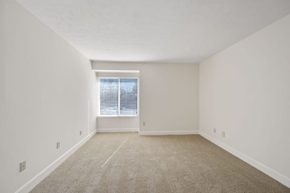 an empty room with carpet and a window at Harpers Point Apartments, Cincinnati,OH, 45249