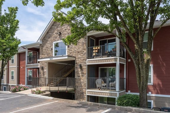 Properties with balconies and a tree at Galbraith Pointe Apartments and Townhomes, Cincinnati