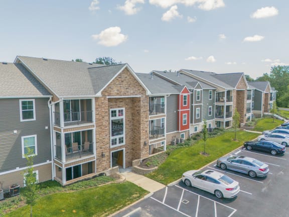 Aerial view of an apartment complex with cars parked in a parking lot  at Hilltop Apartments, Ohio, 45213-2638
