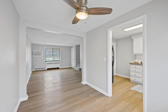 a living room and dining room with a ceiling fan at Huntley Ridge, Ohio