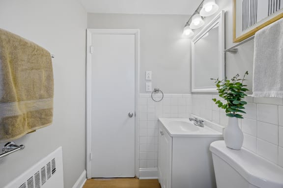 a small bathroom with a sink and a mirror and a shower at Huntley Ridge, Kettering, OH, 45419