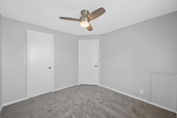 a bedroom with white walls and a ceiling fan at Huntley Ridge, Kettering, OH, 45419