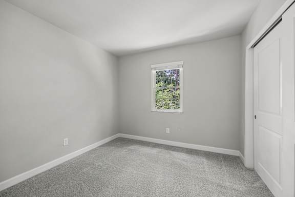 A room with a window and a door.