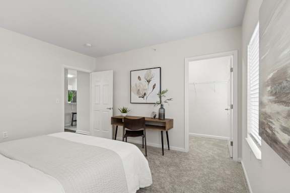 A bedroom with a bed, desk, and chair. at Roebling Row, Kentucky, 41011-1720