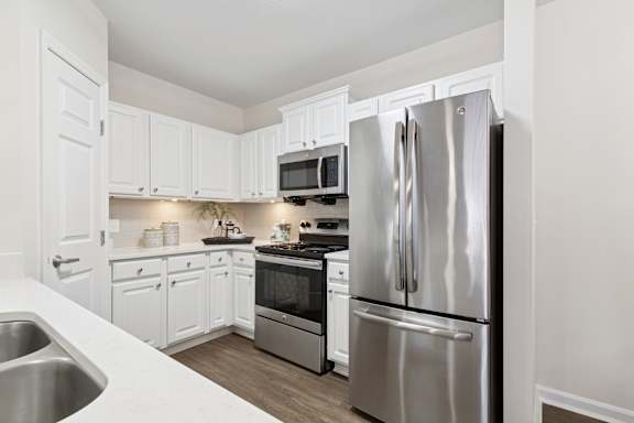 A modern kitchen with a stainless steel refrigerator. at Roebling Row, Kentucky, 41011-1720