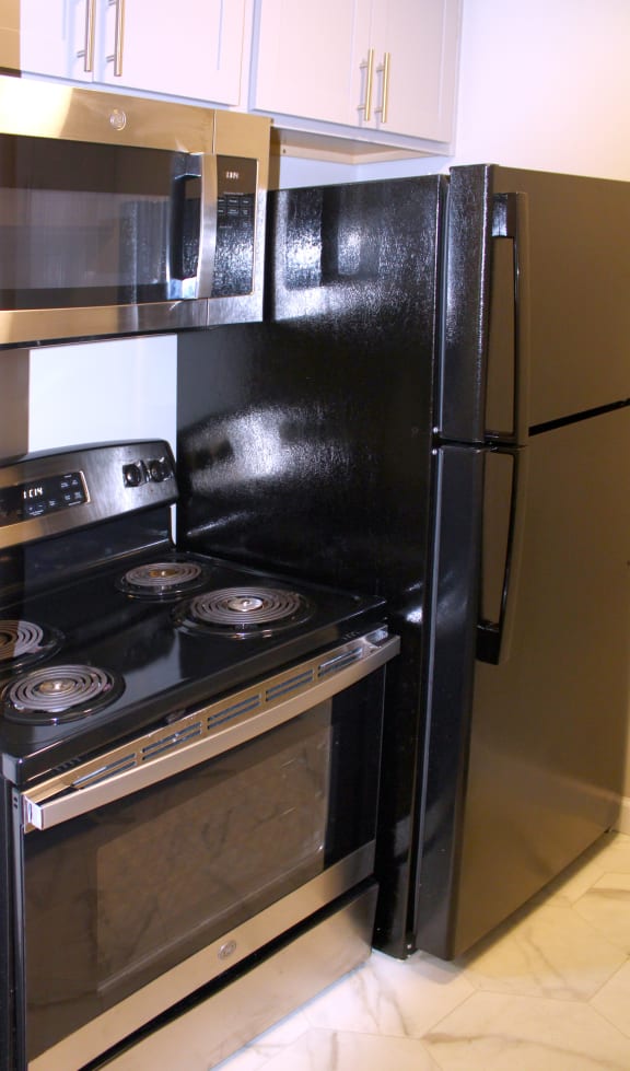 a kitchen with a stove and a refrigerator at Cincinnati Premier Living*, Cincinnati, 45213