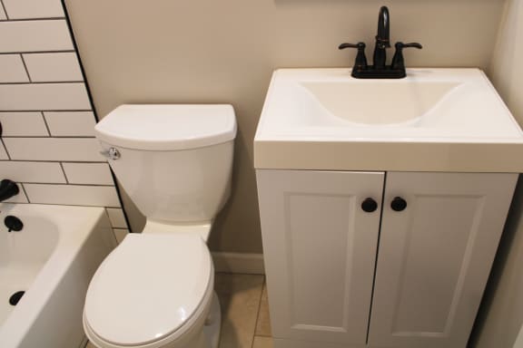 a bathroom with a toilet sink and bathtub at Cincinnati Premier Living*, Cincinnati, Ohio