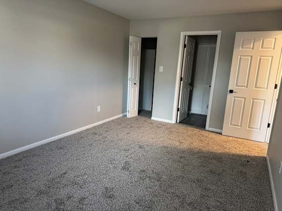 Room with carpet and bathroom at Quail Run Apartments, Columbus