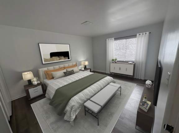 A bedroom with a large bed and a painting on the wall.