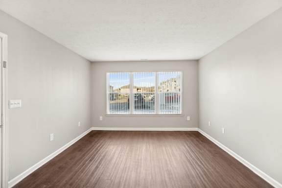 Room with a window overlooking a street at Waterfront Pointe, Indianapolis, 46214