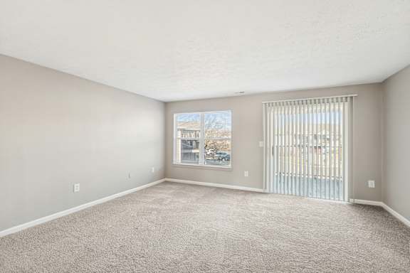 carpeted floor and a window at Waterfront Pointe, Indianapolis