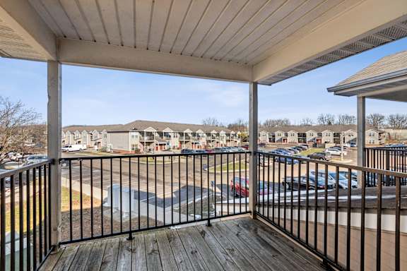 A balcony with a black railing at Waterfront Pointe, Indianapolis Indiana