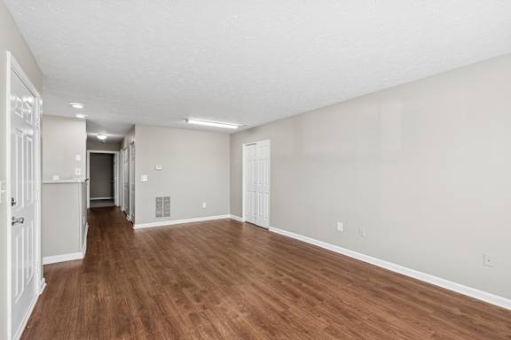 A long empty room with wood floor  at Waterfront Pointe, Indiana, 46214