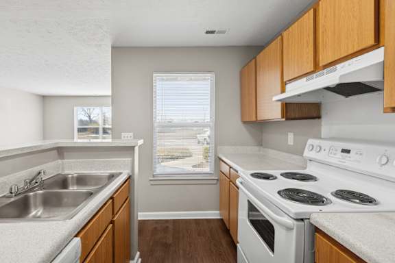 A kitchen with sink, and window at Waterfront Pointe, Indianapolis, 46214