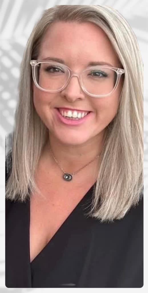 a young woman wearing glasses and a necklace