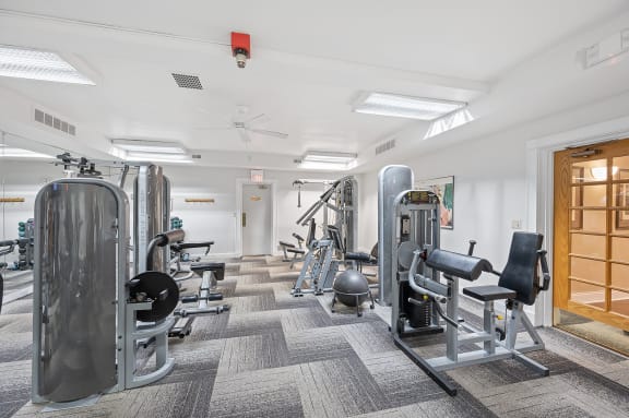 a row of fitness equipment in a room with yoga machines at Indian Creek Apartments*, Cincinnati, OH