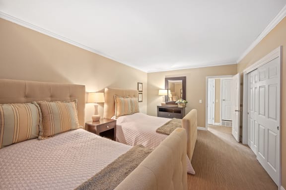 a bedroom with two beds and a door to a bathroom at Indian Creek Apartments*, Ohio, 45236