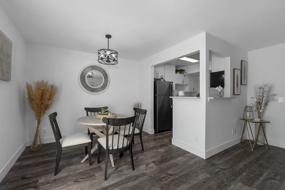 an open kitchen and dining area with a table and chairs at Ivy Hills Living Spaces, Ohio