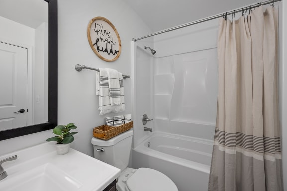 a bathroom with a shower and a toilet and a sink at Ivy Hills Living Spaces, Cincinnati, Ohio