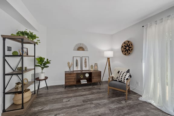 a living room with white walls and ceiling and a chair and a table at Ivy Hills Living Spaces, Cincinnati, OH