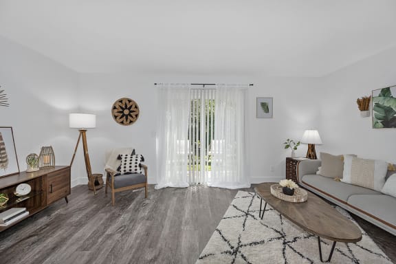 a living room with a clock on the wall at Ivy Hills Living Spaces, Cincinnati, Ohio