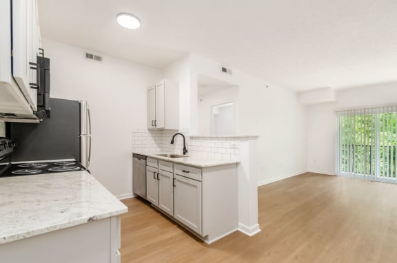 a kitchen with a counter top and a refrigerator