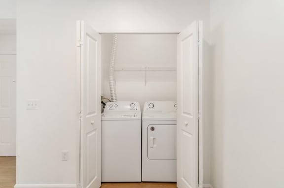 a small laundry room with a washer and dryer