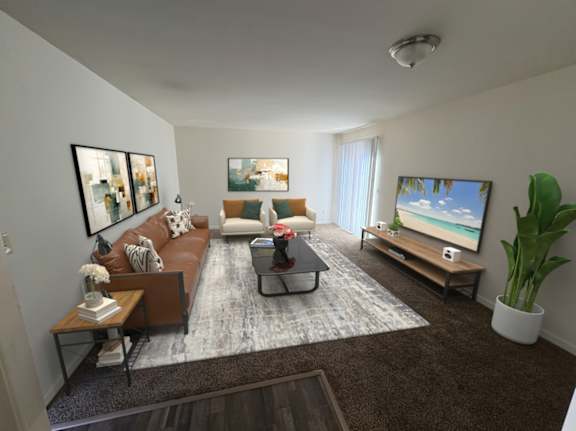 A living room with a brown couch, a coffee table, and a flat screen TV.