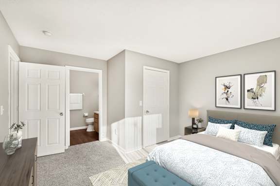 A bedroom with a nightstand at Waterfront Pointe, Indianapolis Indiana