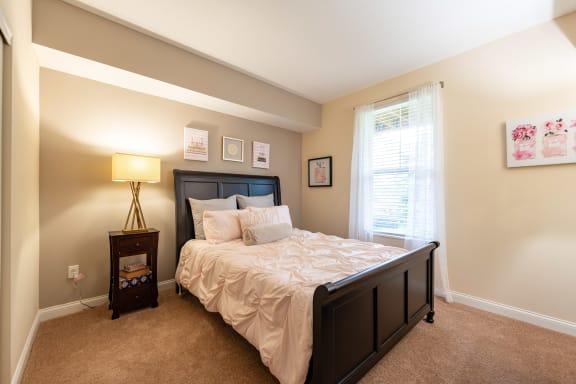 a bedroom with a bed and a window  at Grove City Summit, Grove City, 43123