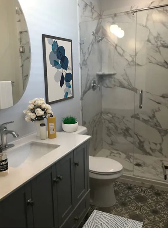 a bathroom with a shower and a sink and a toilet  at Cincinnati Premier Living*, Cincinnati, OH