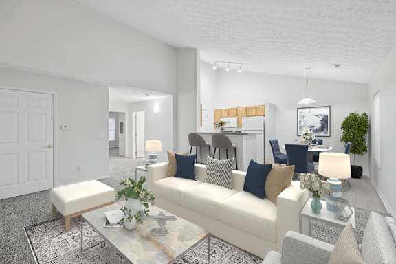 A living room with a white couch, a coffee table, and a rug.