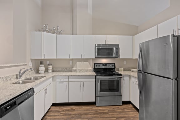 Kitchen with refrigerator at The Lofts at Shillito Place, Cincinnati, Ohio