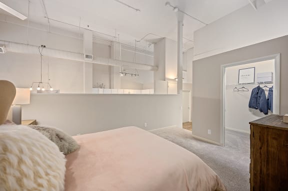 Bed with pillows at The Lofts at Shillito Place, Cincinnati