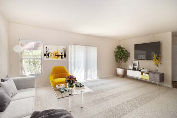 A living room with a yellow chair and a grey couch. at Roebling Row, Covington