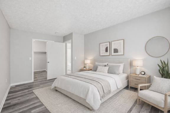 large bed, a chair in bedroom at Timbercreek Apts, Columbus