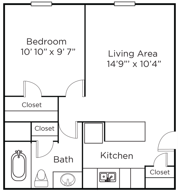 A floor plan of a small apartment with a bedroom, living area, kitchen, and bathroom.