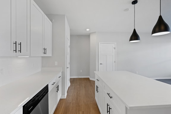 a renovated kitchen with white cabinets and white counter tops at Monmouth Row Apartments, Newport, 41071