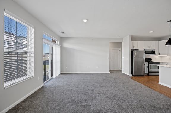 an empty living room and kitchen with a large window at Monmouth Row Apartments, Newport, 41071