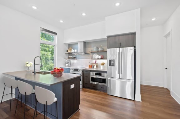 a kitchen with a large island and a stainless steel refrigerator at Four23/Hoge, Cincinnati, OH, 45226