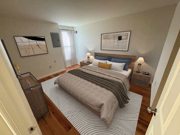 A bedroom with a bed, nightstands, and a painting on the wall.