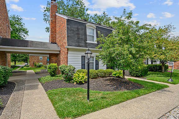 a sidewalk in front of a brick house with a lamp post at Olde Towne in Kenwood, Ohio, 45243