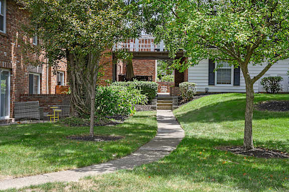 a sidewalk in front of a brick house at Olde Towne in Kenwood, Cincinnati