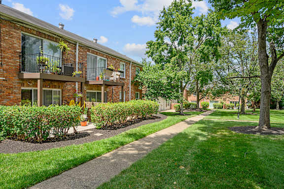 a sidewalk in front of a brick apartment building at Olde Towne in Kenwood, Cincinnati, 45243