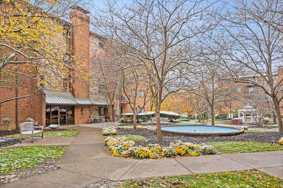 A brick building with a pool in the yard. at Indian Creek Apartments*, Cincinnati, 45236