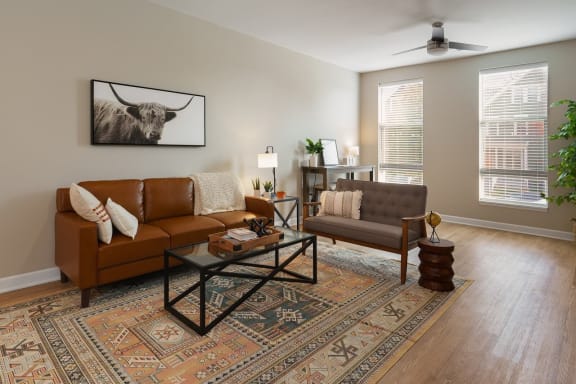 a living room with a couch and a coffee table at Adelphi Quarter, Columbus, OH