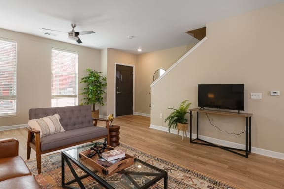 a living room with a couch and a television at Adelphi Quarter, Columbus, OH, 43203