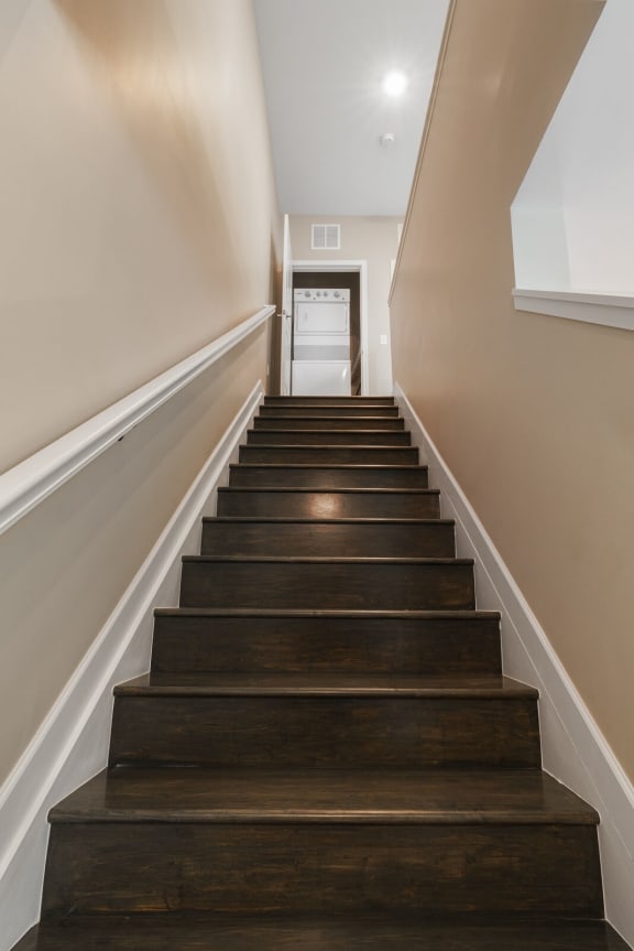 a staircase with wooden stairs  at Adelphi Quarter, Columbus, Ohio